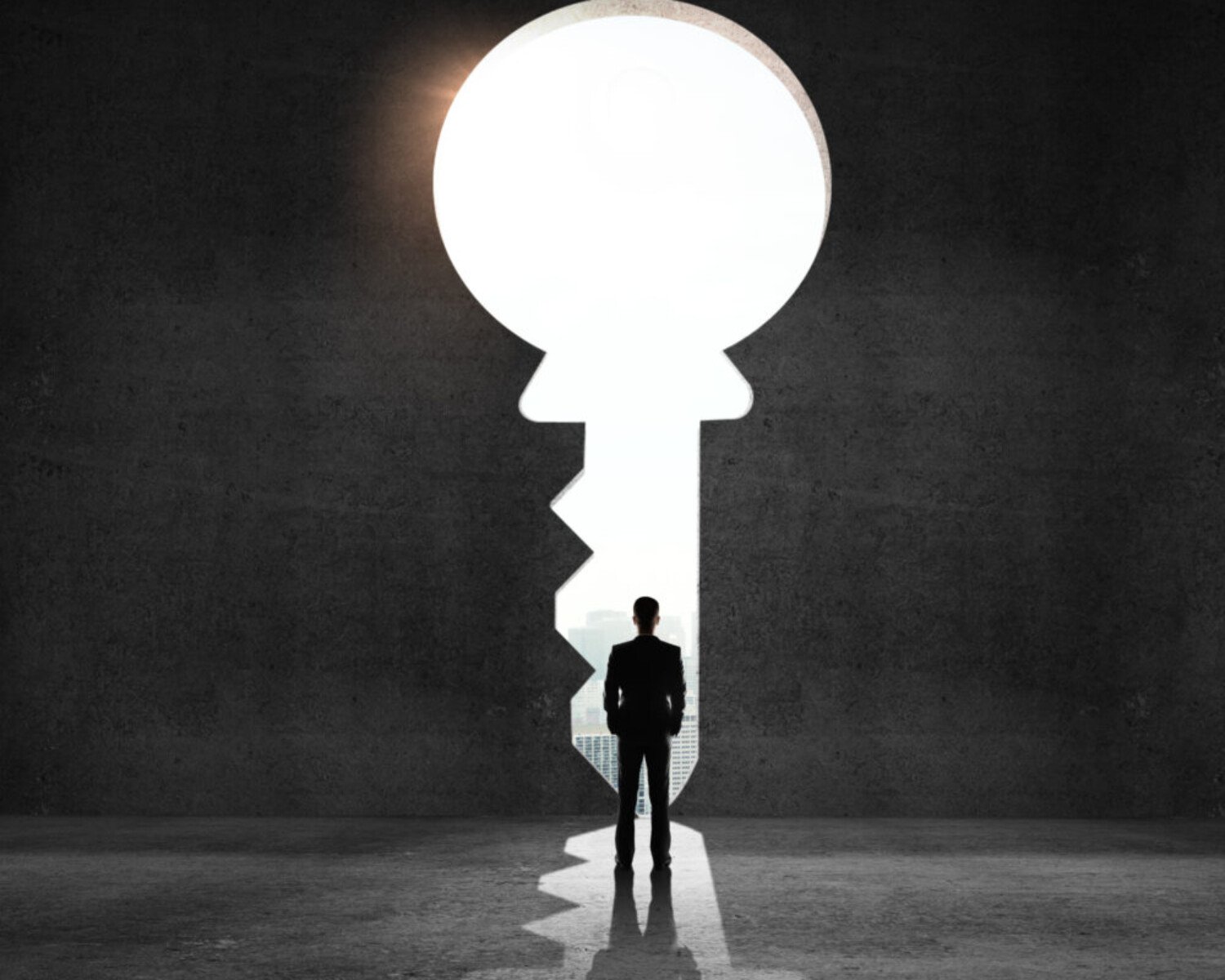 businessman looking an big key and drawing concept
