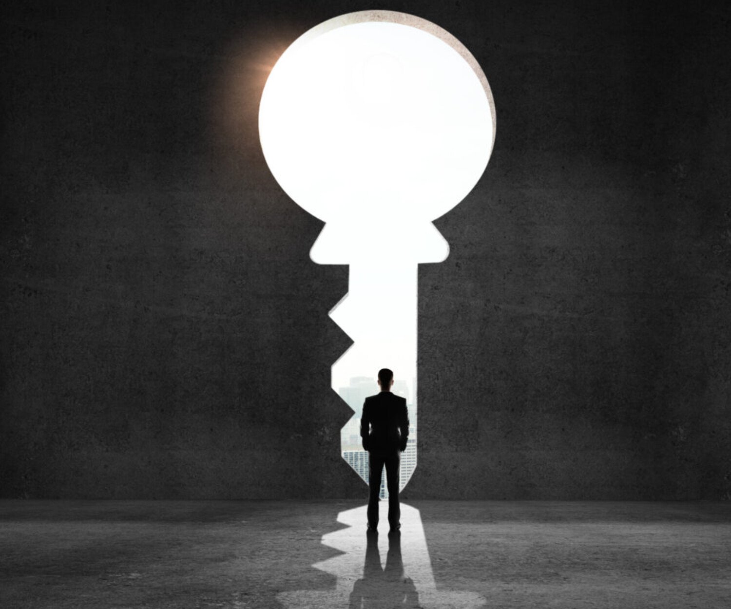 businessman looking an big key and drawing concept